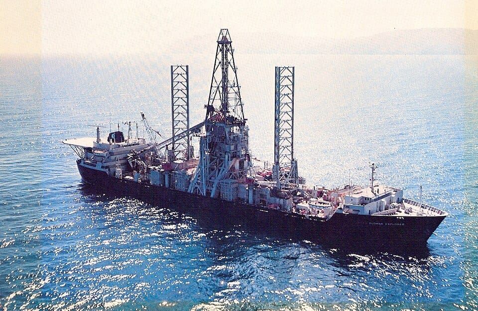 Photo of a large ship with a very large crane on its deck
