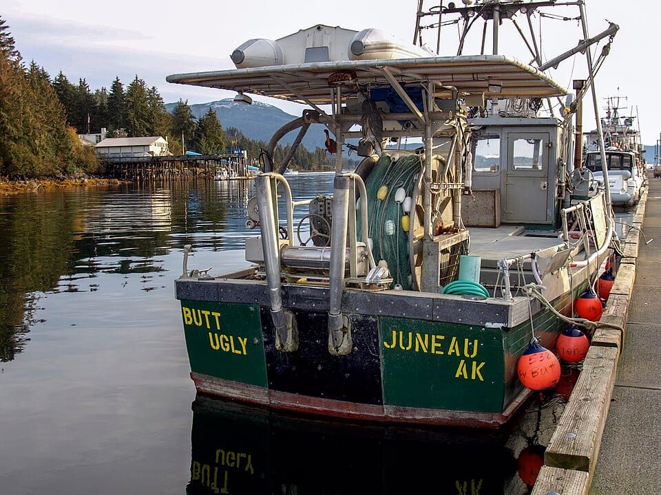 Photo of a fishing boat with the name Butt Ugly moored at a quay in Juneau, Alaska