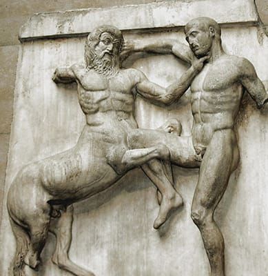 Marble frieze of a centaur grabbing a man by the throat; the man is grabbing the centaur’s hair
