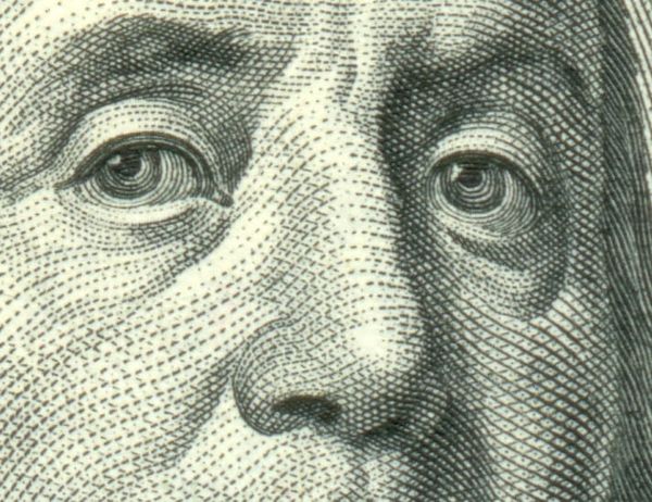 Closeup of Benjamin Franklin’s nose on a US$100 bill