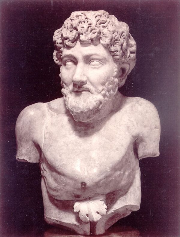 Photo of a marble bust of a bearded, curly-haired man