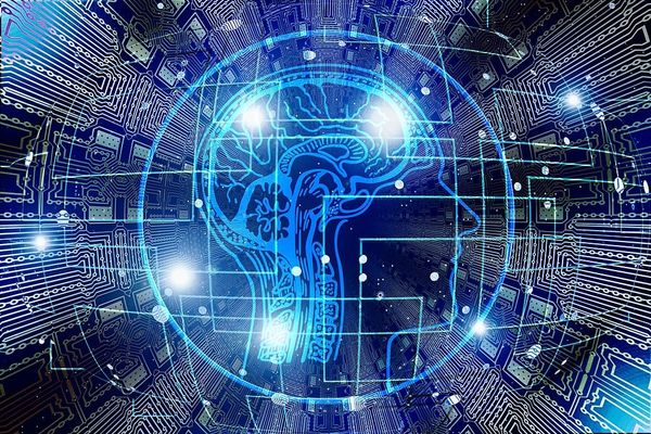Drawing of a human brain superimposed upon the circuitry of a computer chip