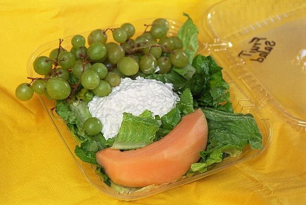 Photo of a salad consisting of lettuce, grapes, cantaloupe, and small-curd cottage cheese