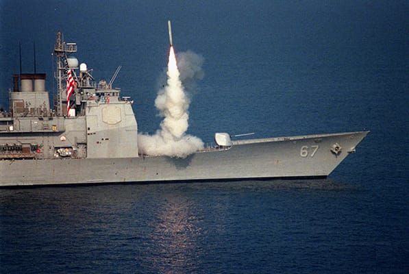 Photo of a US Navy Ticonderoga-class cruiser firing a missile