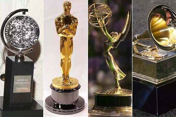 Photo montage of four major entertainment award statuettes