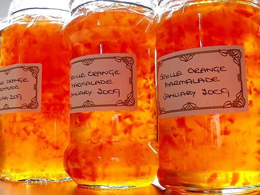 Three jars of homemade marmalade labeled “Seville Orange Marmalade January 2009”