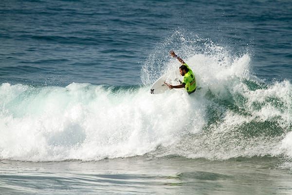 Photo of a surfer riding a gnarly (rough) wave