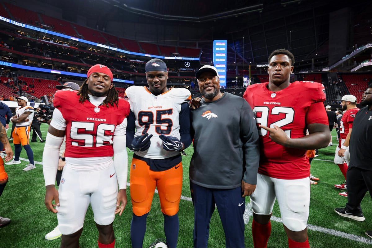Former LSU DL coach Jamar Cain, now Denver’s defensive line coach, posed with ex-Tigers Saivion Jones,…