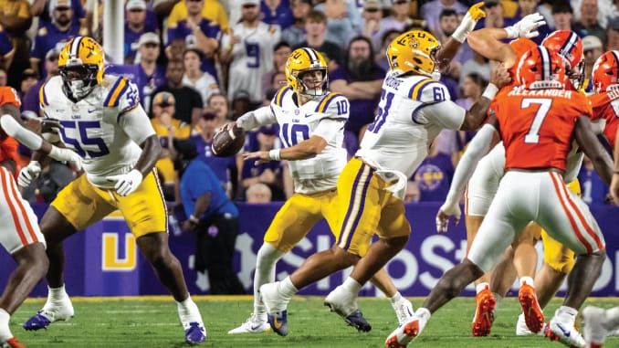 Leavitt’s LSU debut: 230 pass + 113 rush, 3 TDs. Twisting 8-yard dive after looking out of bounds. Dual-threat is real. (Tiger Rag / LSUsports)
