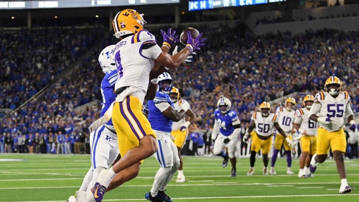 Kentucky stuns No. 10 LSU 35-34 in overtime when Kenny Minchey walks in the two-point try