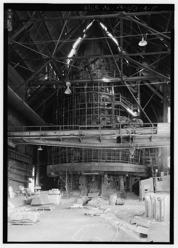 Black and white picture of very large cylindrical blast furnace in Pittsburgh Steel Company Monessen works 