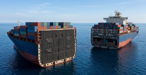 AI-generated image of a container ship cut in half, with both halves floating on the ocean