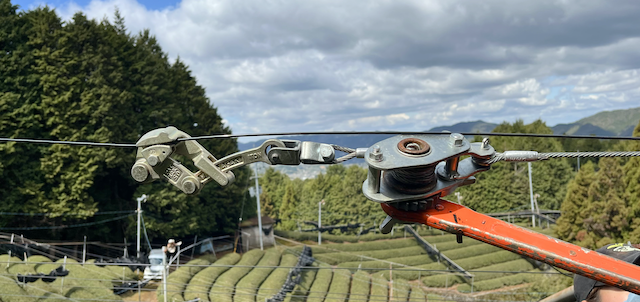 Re-tensioning roof style shading cables where the shading material clips on.