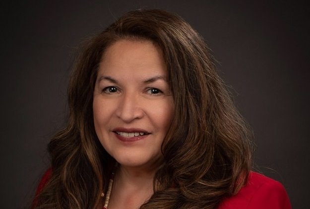 A portrait of Claudia Kauffman, looking into the camera.