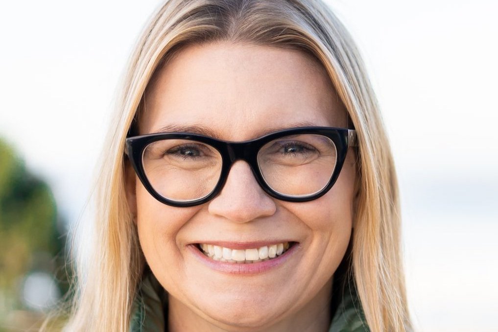 A close-up portrait of Tyler Crone, smiling at the camera.