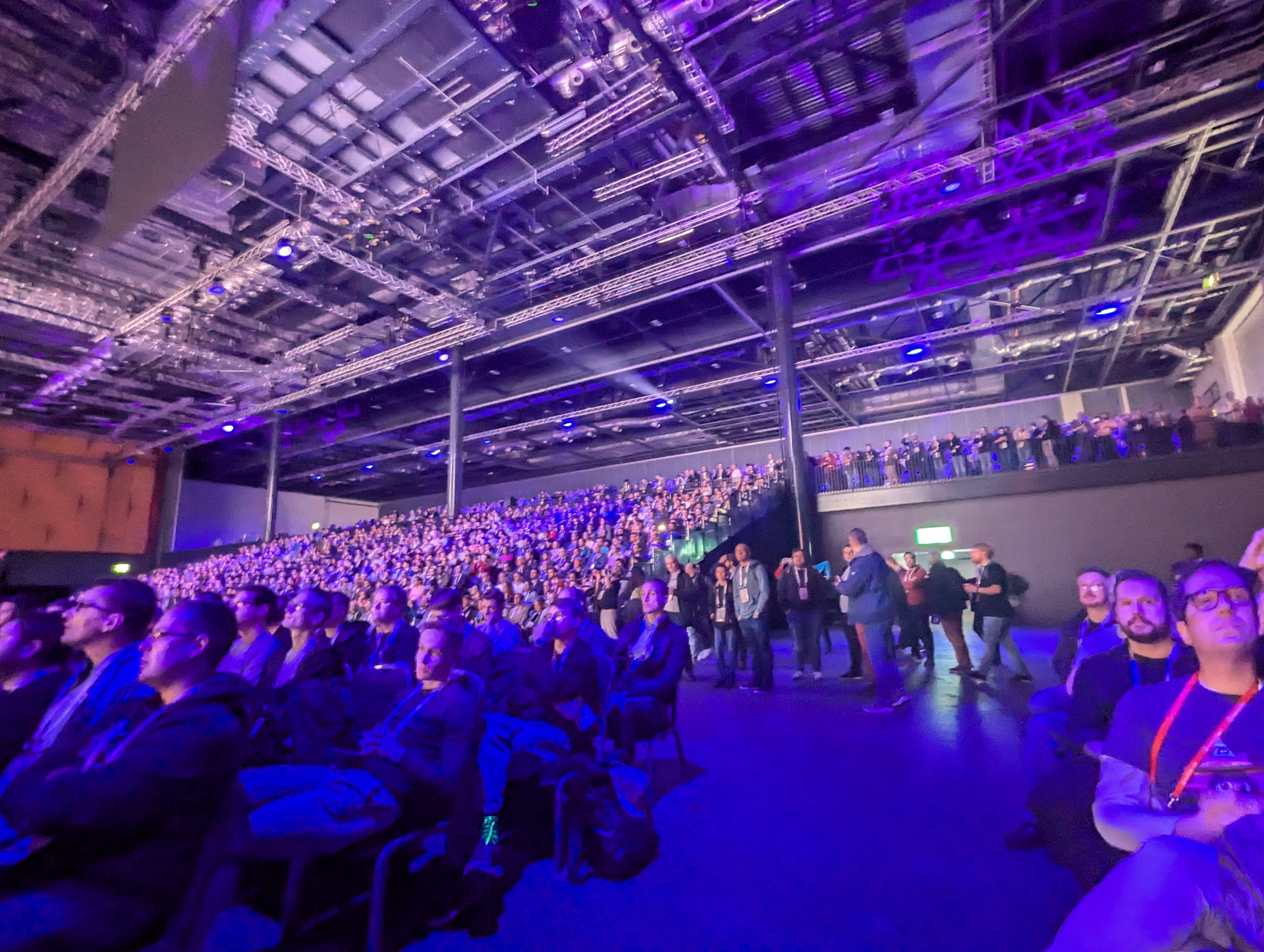 A picture of a crowded conference hall behind me