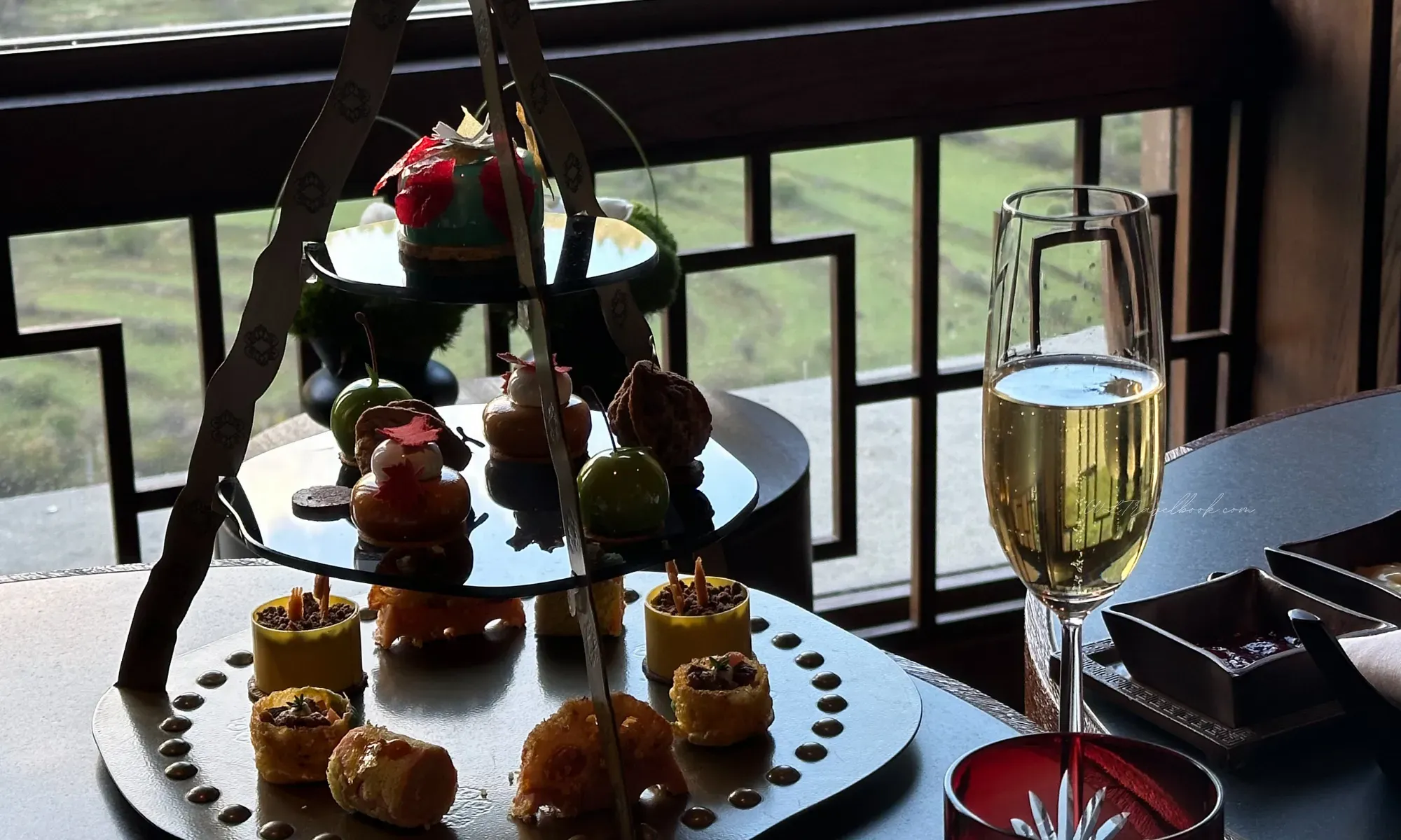 Group gathered for high tea at Rissai Valley, showing communal dining experience and service without theatricality, by WLTravelbook