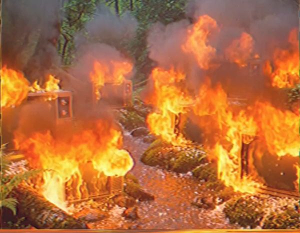 CRT televisions on fire in the woods