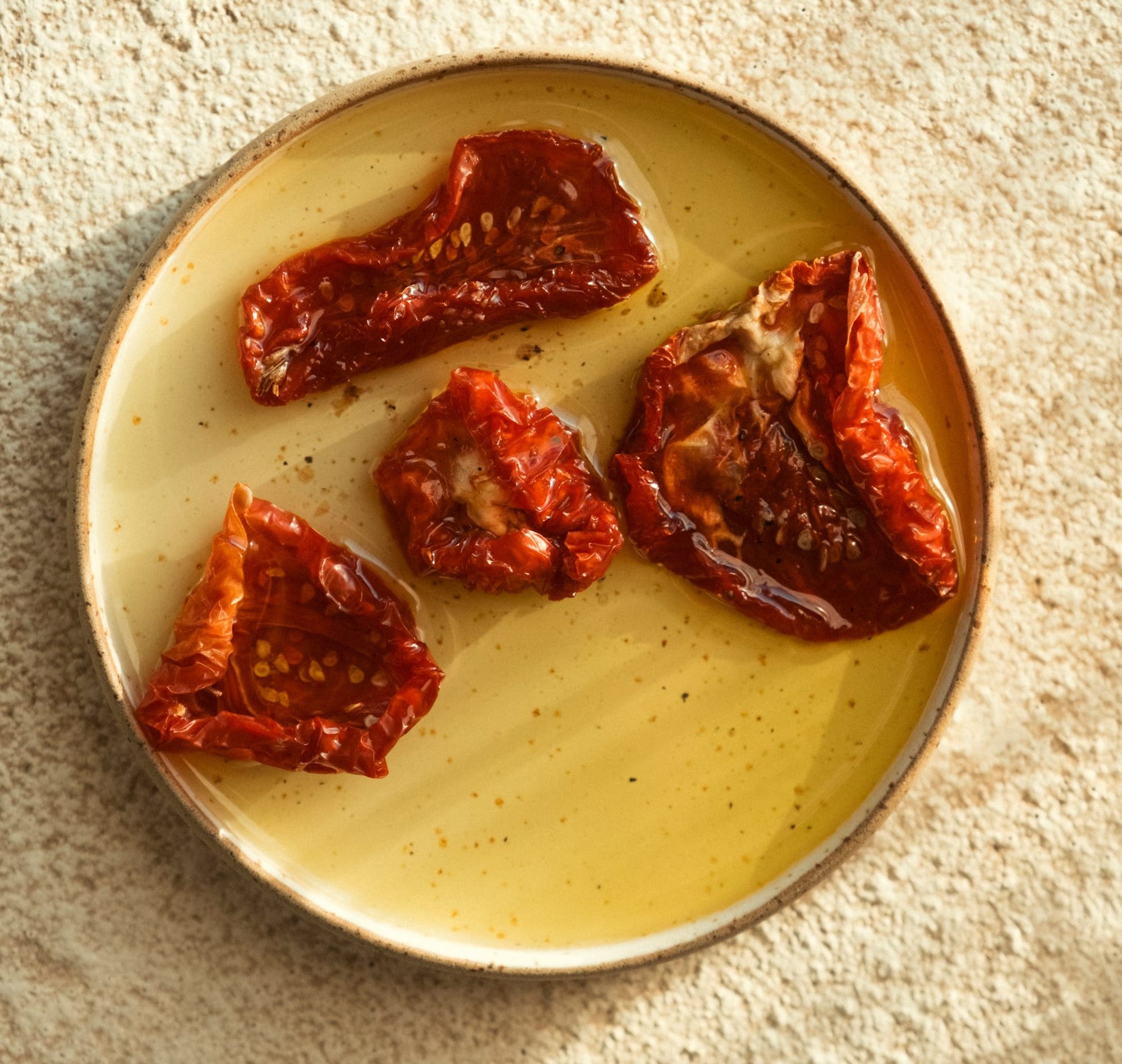 Sun-dried tomatoes in oil on a plate