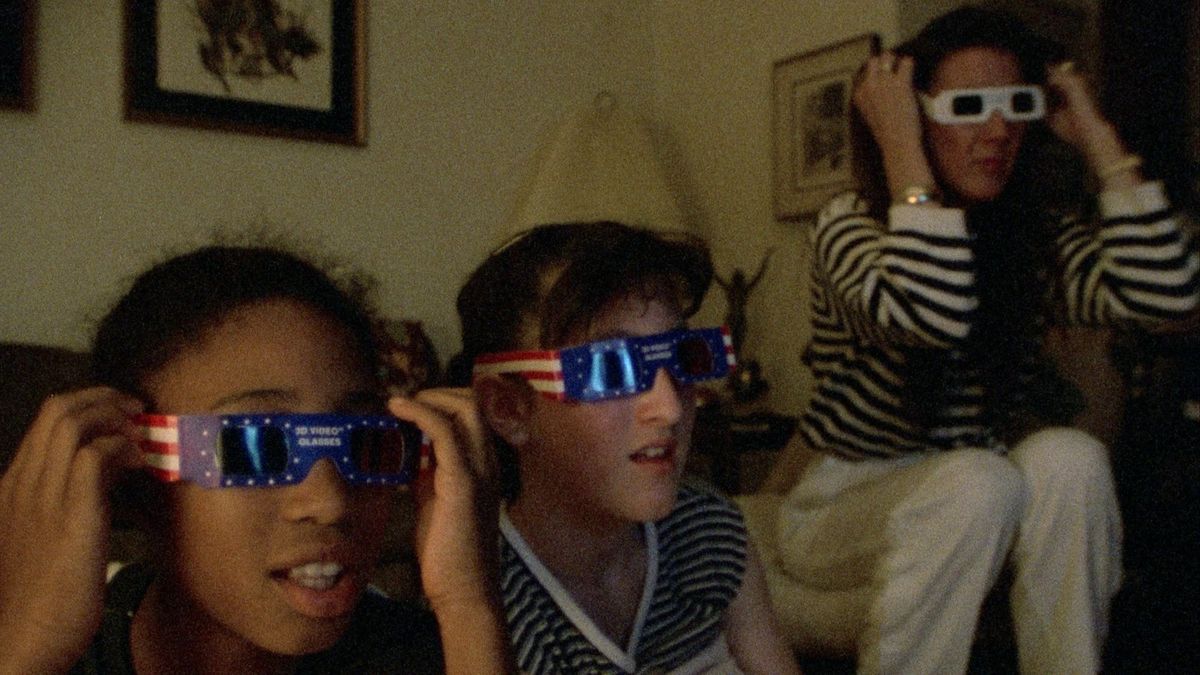 Claudia Chandler with daughter Ashley and classmate watching 3D horror movie on TV in SHERMAN’S MARCH. Courtesy of Music Box Films.