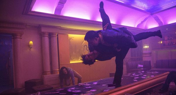 a kinetic fight scene from THE FURIOUS, in which two grappling characters feature legs spinning in the air like helicopter blades