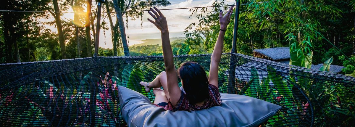 Woman in hammock overlooking ocean in Costa Rica