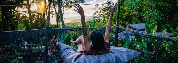 Woman in hammock overlooking ocean in Costa Rica