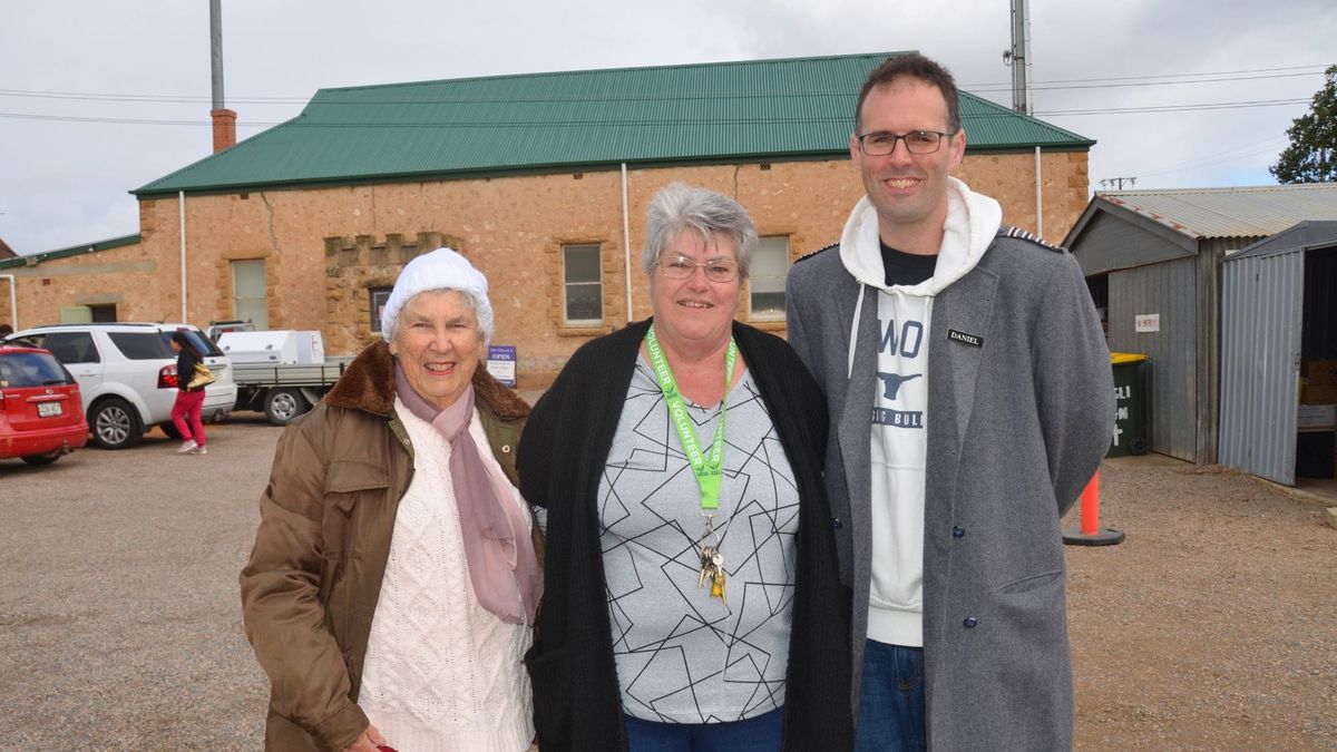 Margaret May, Deb Rew and Daniel Irvine celebrate the completion of the new roof at the St John’s op shop in Murray Bridge.