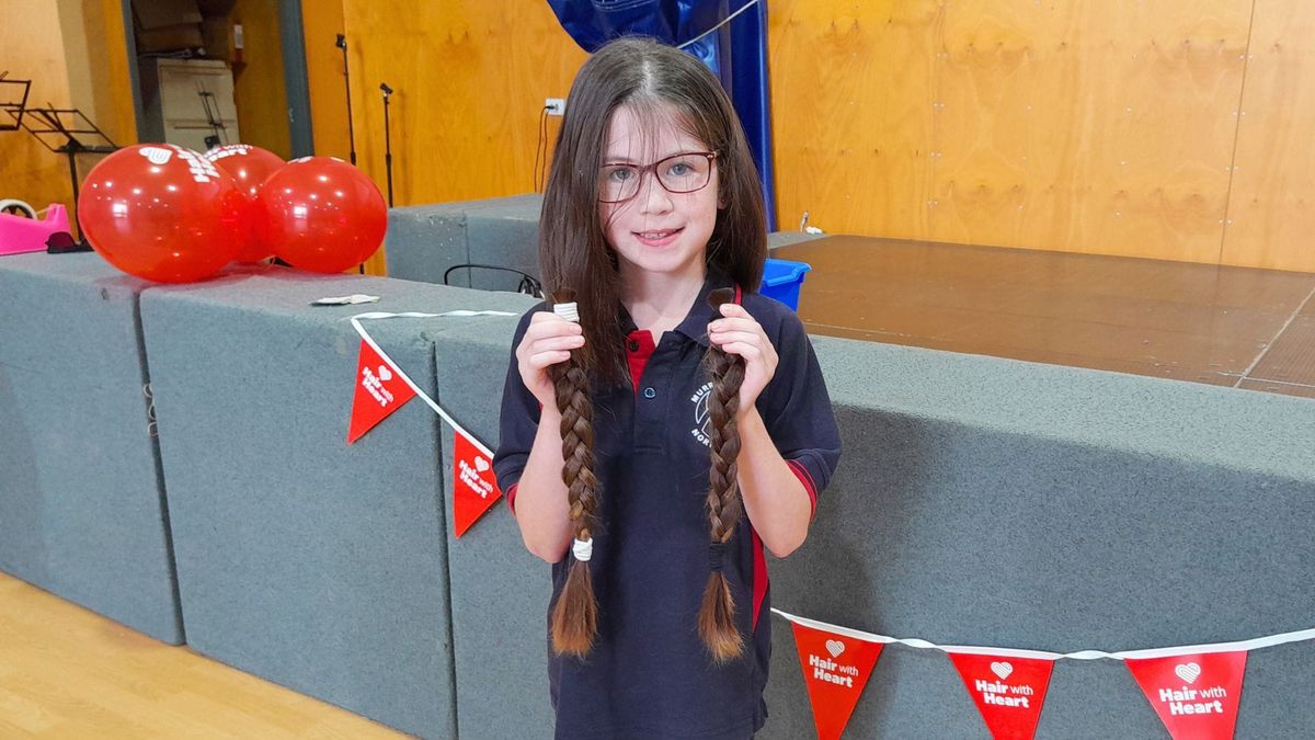 Brave schoolgirl snips her locks for kids in need