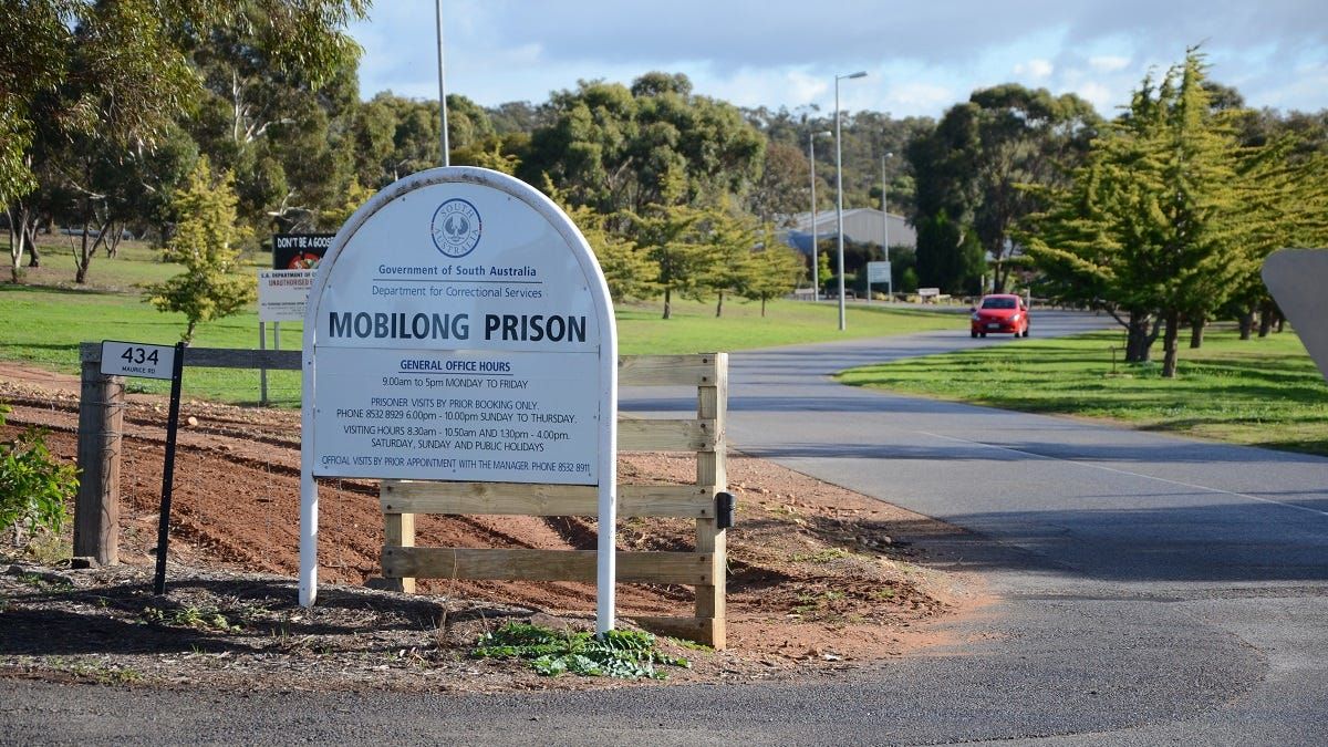 Prison officer arrested at Mobilong