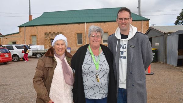 Margaret May, Deb Rew and Daniel Irvine celebrate the completion of the new roof at the St John’s op shop in Murray Bridge.