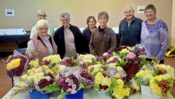 Volunteers deliver Mothers Day flowers to women in hospital and aged care