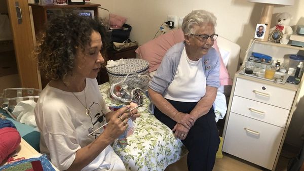 Nursing home resident knits for those in need