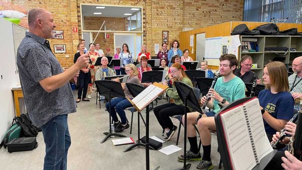 Community choir crashes concert band practice for a Christmas collaboration