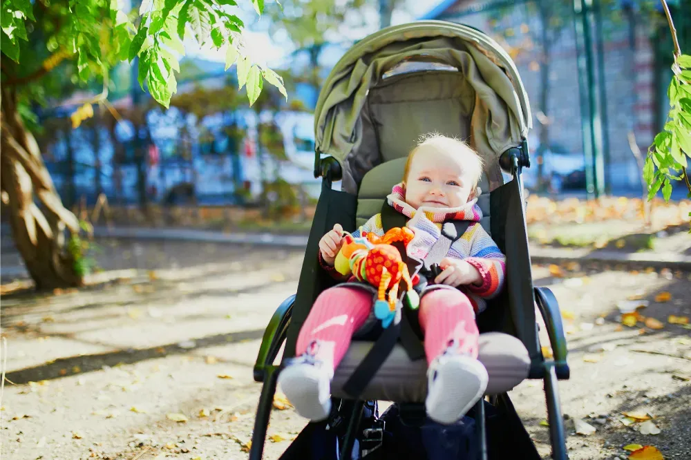 when can baby sit in stroller