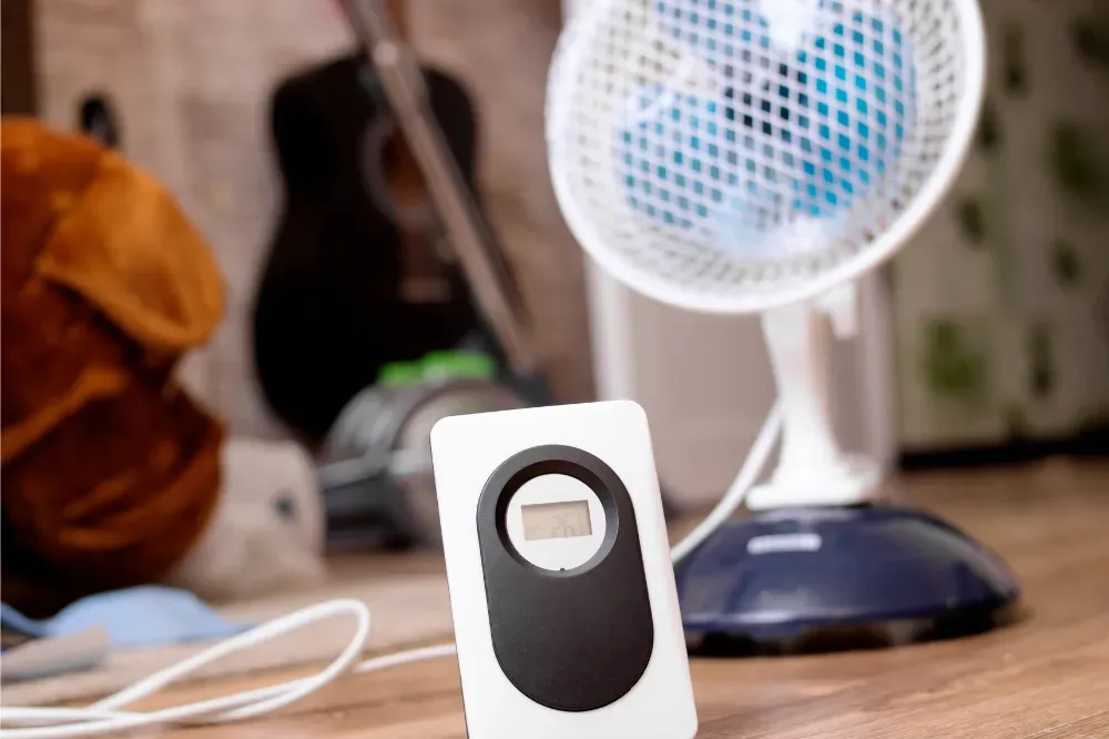 where should a thermometer be placed in a room
