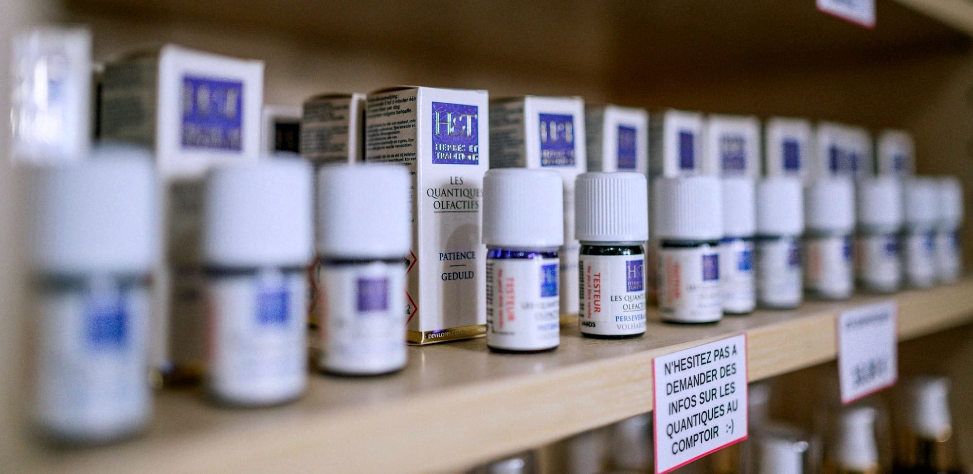 white plastic bottles on brown wooden shelf