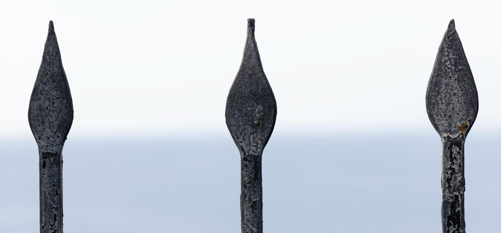 gray wooden post under white sky during daytime