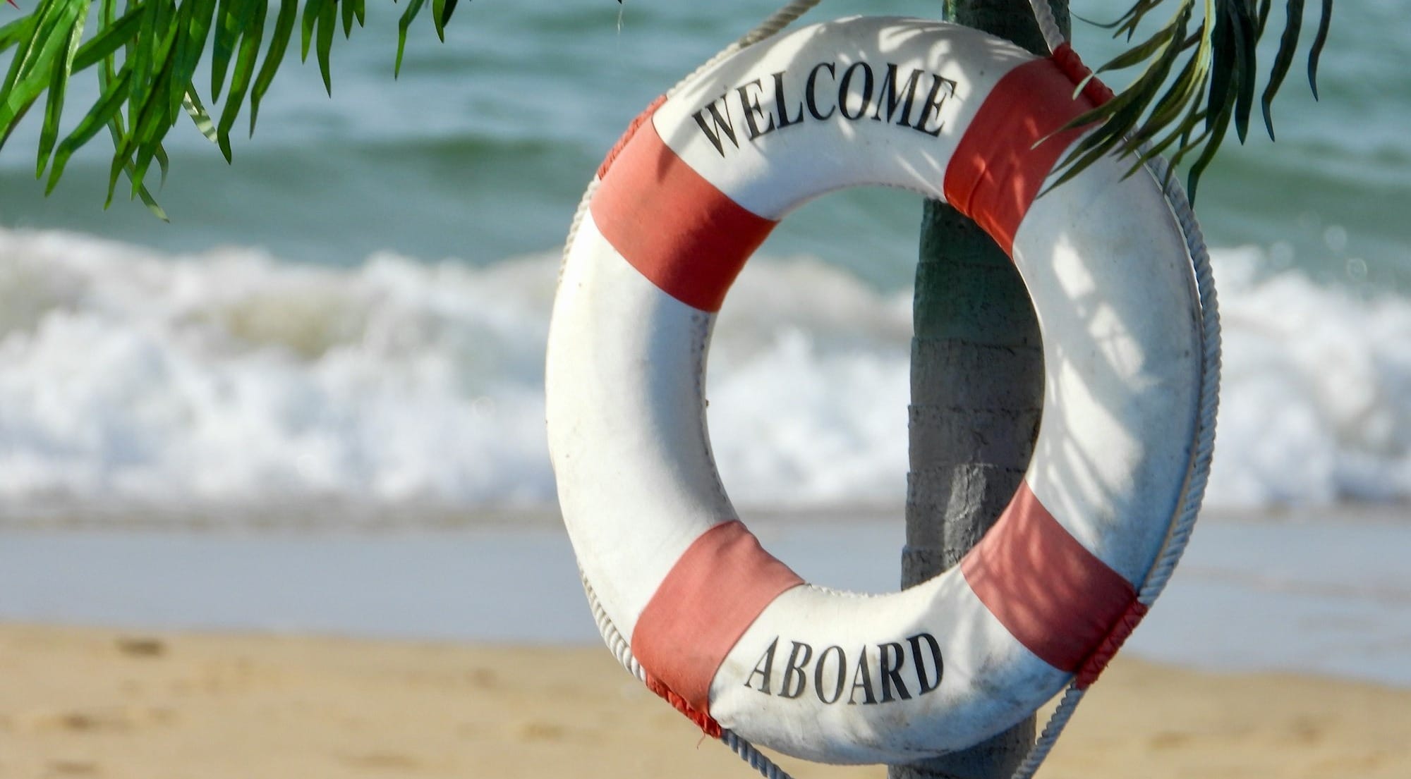 white and orange welcome aboard buoy