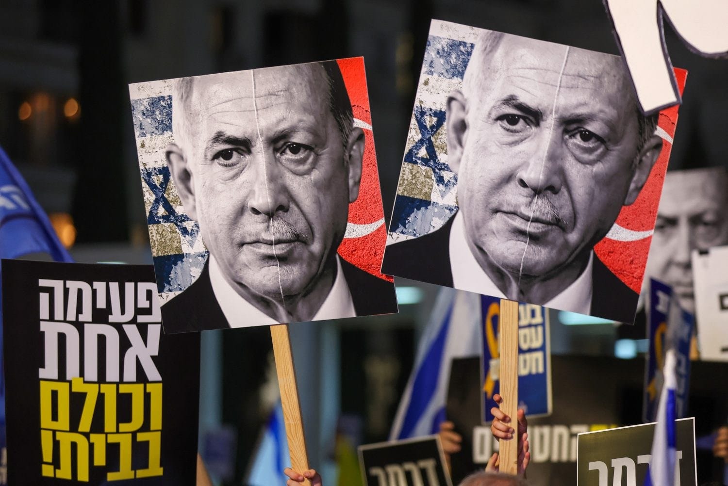 Demonstrators hold placards with the spliced-together portraits of Israeli Prime Minister Benjamin Netanyahu and Turkish President Recep Tayyip Erdogan during an anti-government protest in Tel Aviv, on March 27, 2025.
