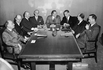Negotiators from the United States, Canada, and five European countries converse after finishing the draft of the North Atlantic Treaty in Washington on March 18, 1949.