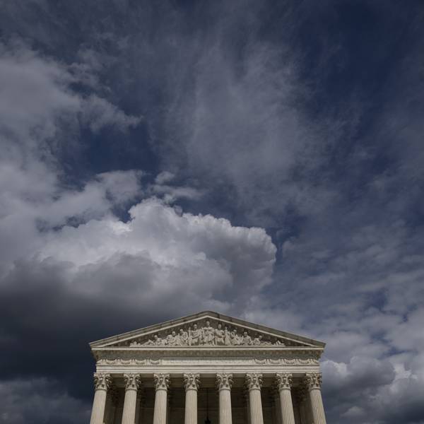 Clouds mass over the Supreme Court building.