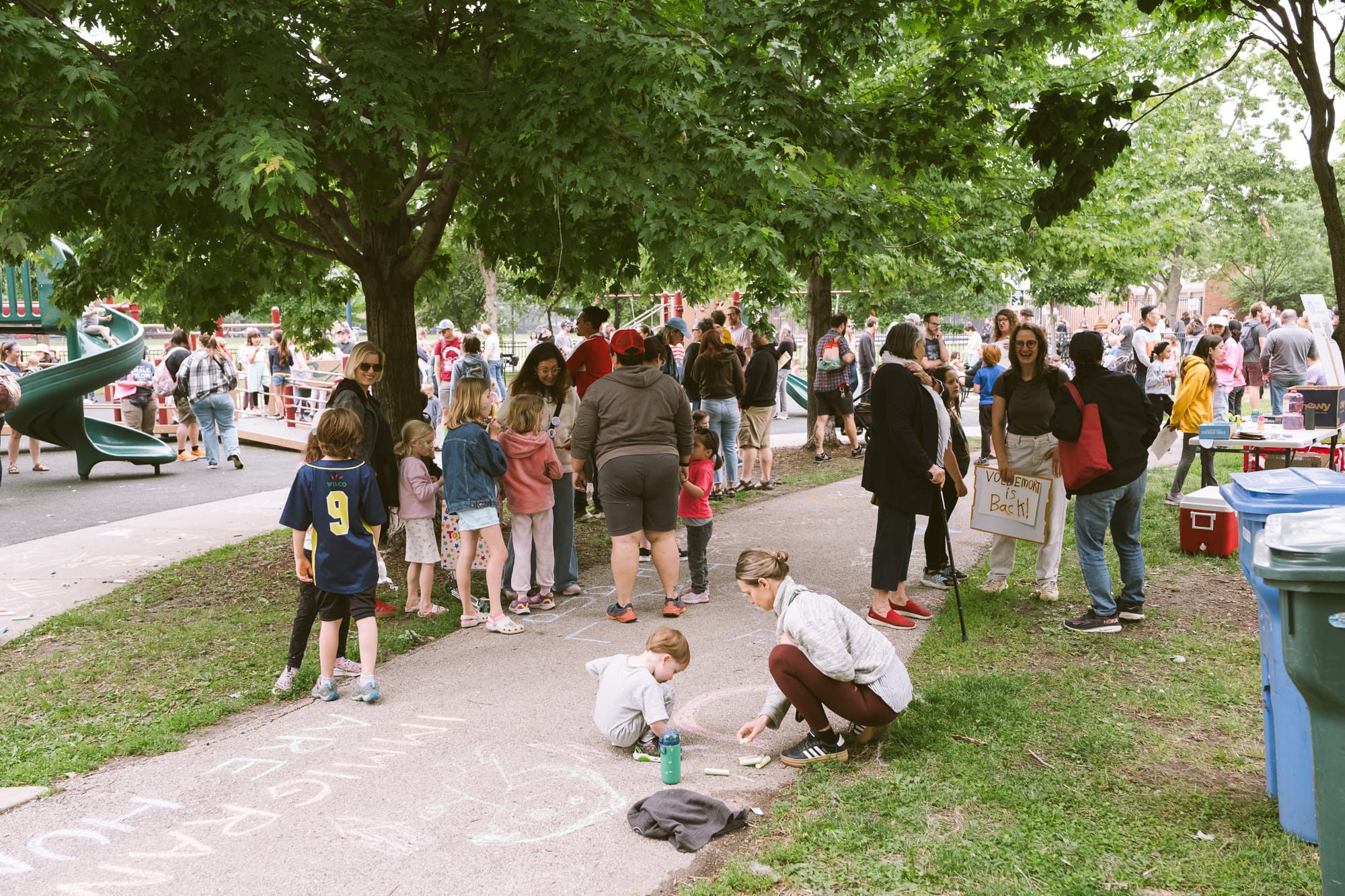 Familes gathered at a Chalk the Walk event