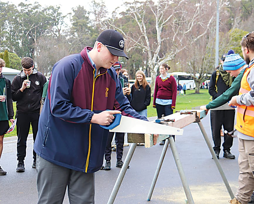 Left: On the Victoria Police stand are (from left) leading senior constable, Paula Fowler, Drouin Secondary College students Aaron Lawrence and Brodie Brindley and leading senior constable Warren Briggs.Right: At the Students of the World Exchange stand are Clare Sacker with Trafalagar High School studnets Tilly Ott and Alexander Wheatland.