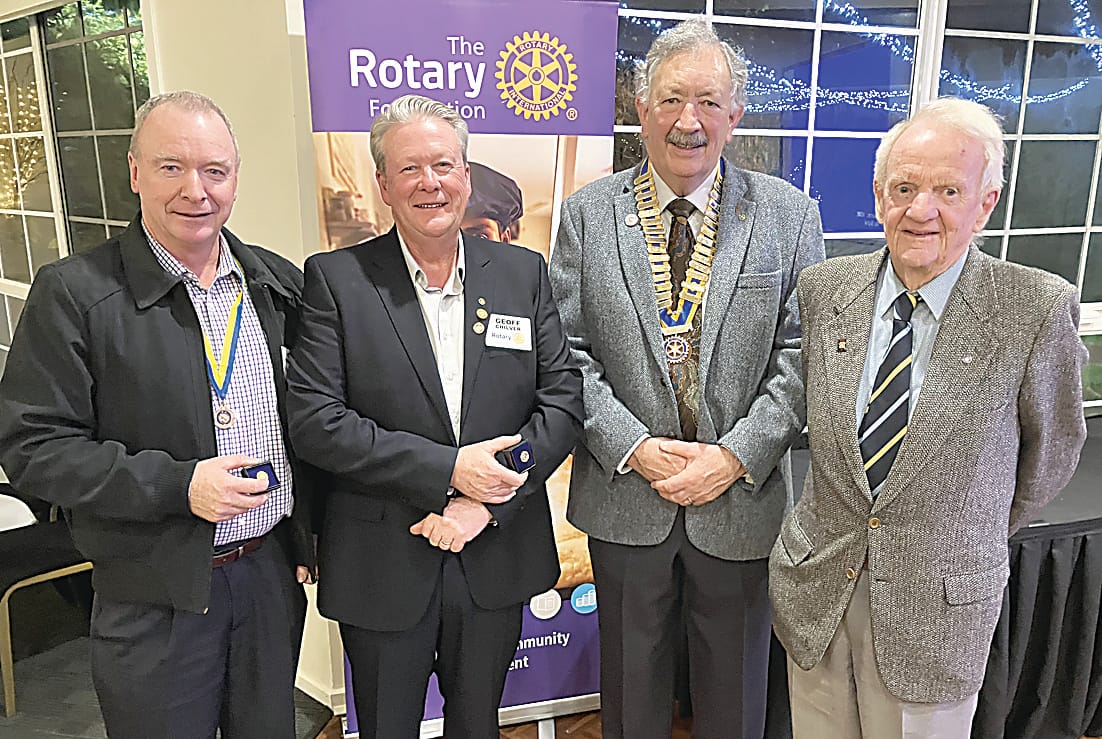 Outgoing president Tony Carson (second right) presents Paul Harris Fellow Sapphire pins to Chris Wilkinson, Geoff Chilver and Bob Lewis.