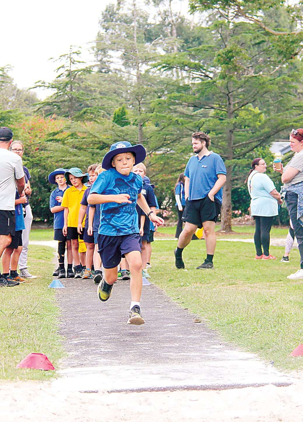 Kayde from Neerim South has his game face on as he runs towards the long jump pit.