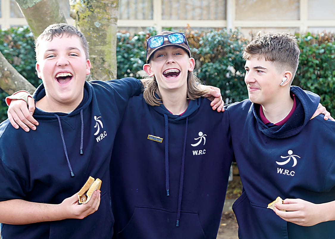 Enjoying the barbecue lunch on offer are (from left) Liam Cameron, Tyler McIntosh and John Tzitziras. Photographs by AMANDA EMARY