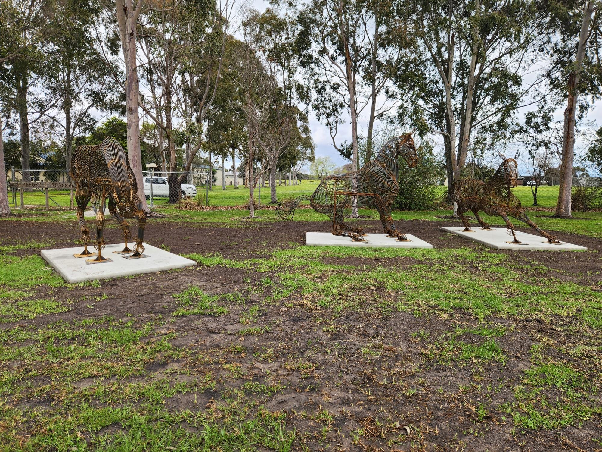 In front of the rodeo artwork unveiled in Lang Lang are (from left) deputy mayor Cr Alanna Pomeroy,  Lang Lang Pastoral, Agricultural and Horticultural Association president Leigh Kirby, sculpture artist Adam Humphreys and Westernport Ward Cr Trudi Paton.