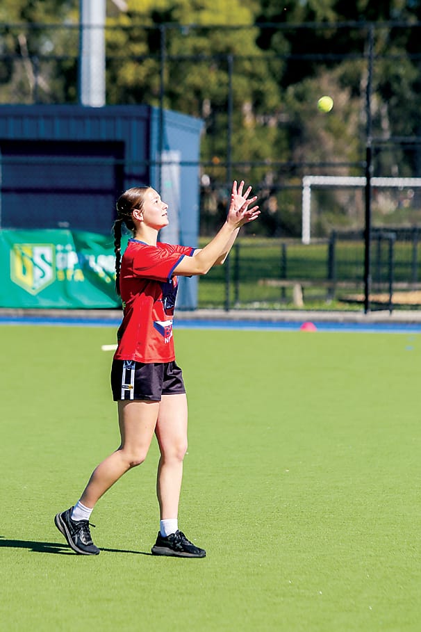 Fifteen-year-old Tilly Percy practices her catching skills.