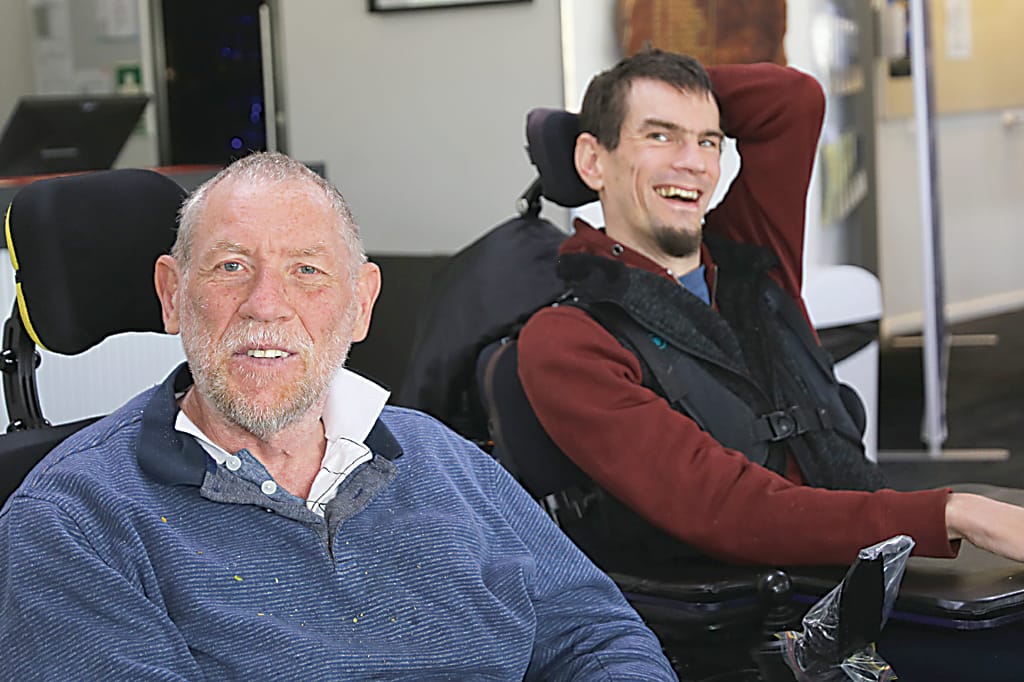 Tim O'Keefe and Matt Anderson from Scope Gippsland are all smiles at the Great Chase event.